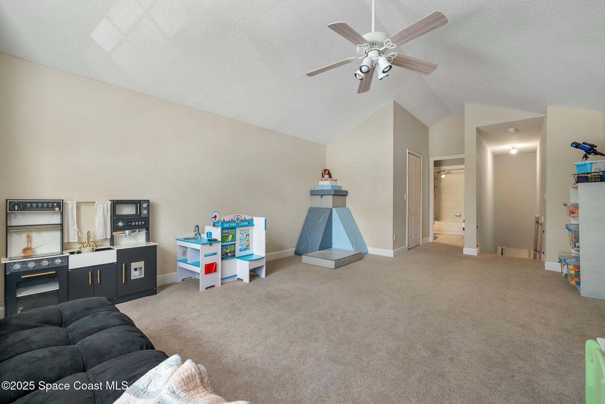 320 Pebble Hill Way Rockledge, FL 32955 - Photo 27 of 34 a living room with furniture and a chandelier