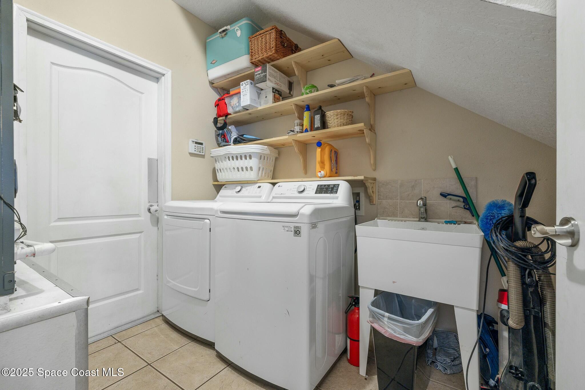 320 Pebble Hill Way Rockledge, FL 32955 - Photo 29 of 34 a utility room with dryer and washer