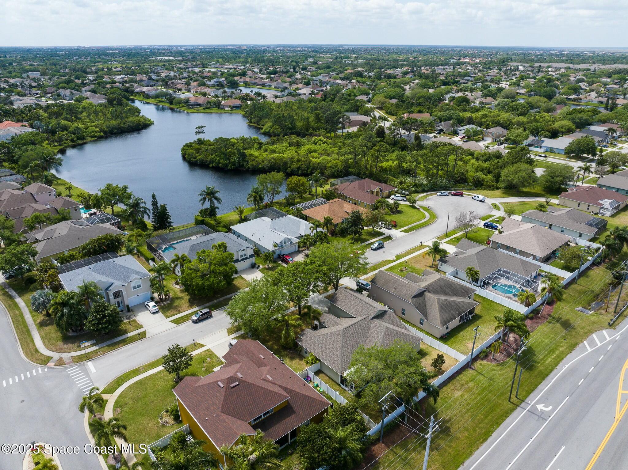 320 Pebble Hill Way Rockledge, FL 32955 - Photo 34 of 34 an aerial view of residential houses with outdoor space