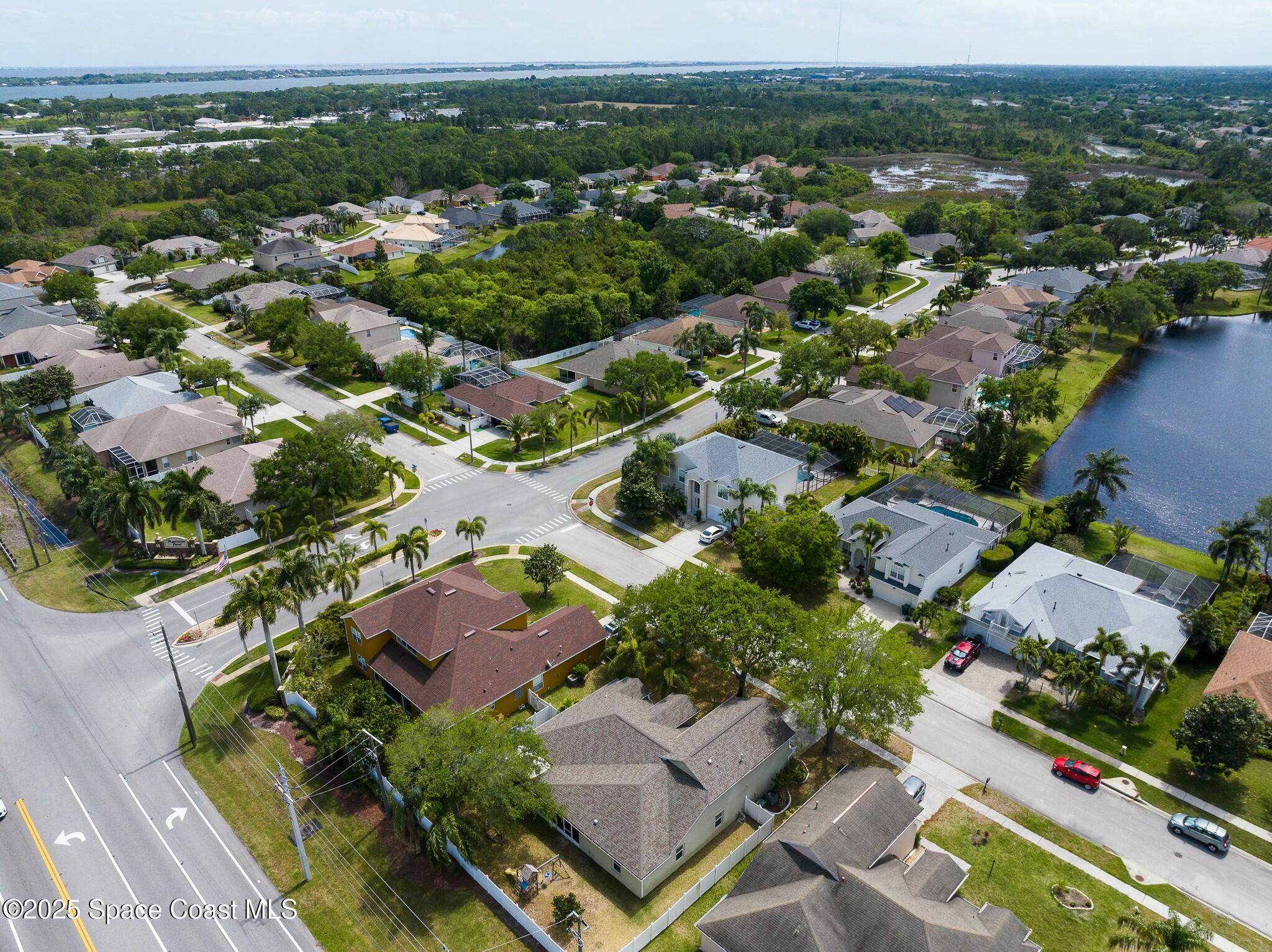 320 Pebble Hill Way Rockledge, FL 32955 - Photo 5 of 34 an aerial view of residential houses with outdoor space