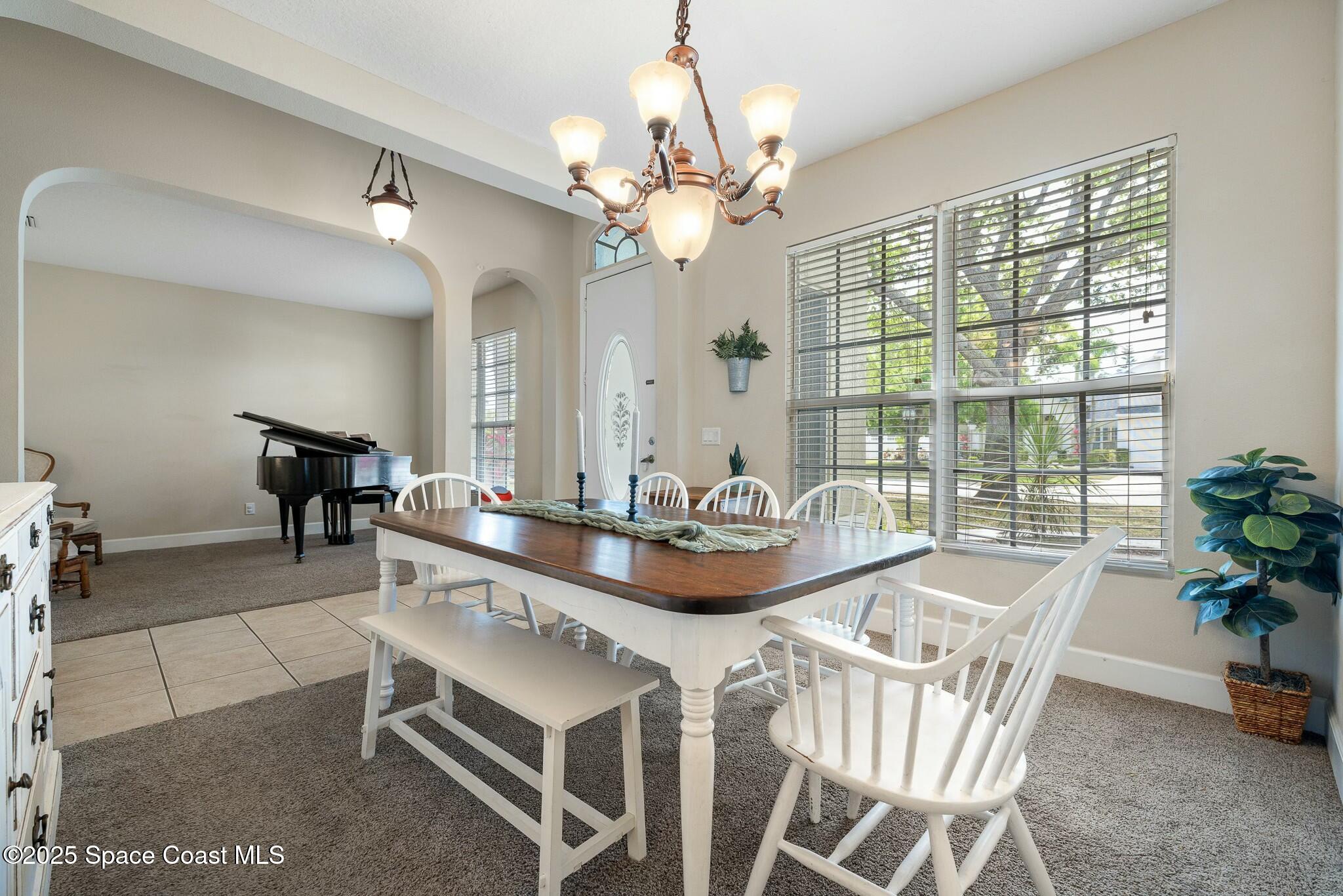 320 Pebble Hill Way Rockledge, FL 32955 - Photo 7 of 34 a dining room with furniture and large windows
