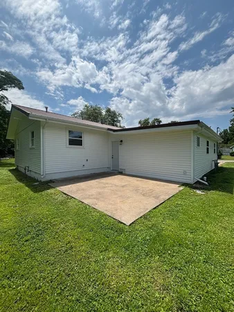a backyard of a house with lots of green space