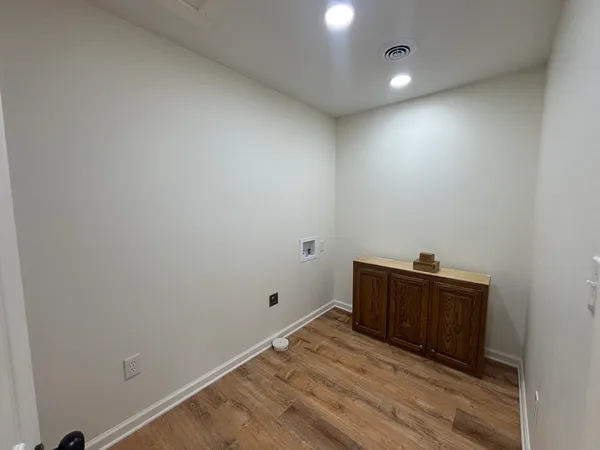 a view of room with wooden floor