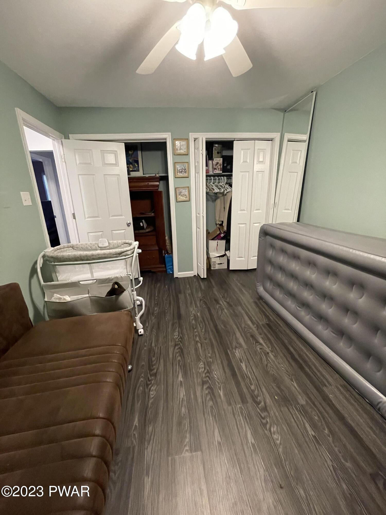 146 Roundhill Road Dingmans Ferry, PA 18328 - Photo 26 of 53 a room with stairs and a wooden floor