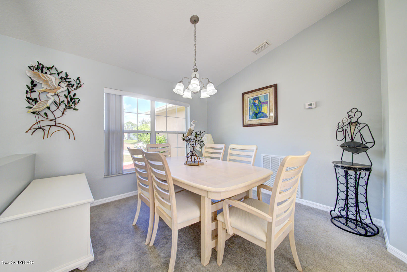 158 Tudor Road Southwest Palm Bay, FL 32908 - Photo 14 of 36 a view of a dining room with furniture and wooden floor