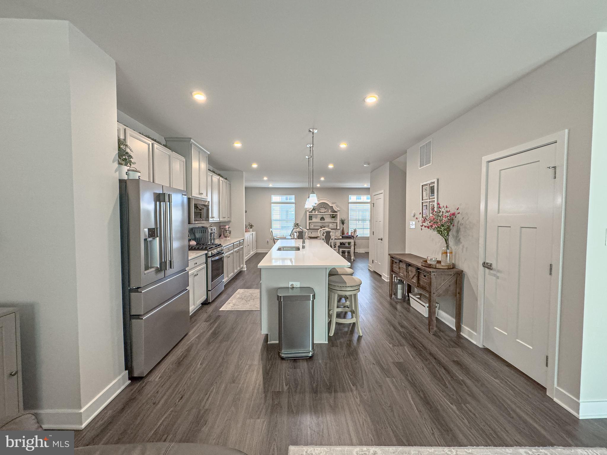 4 Flamingo Court Sewell, NJ 08080 - Photo 14 of 55 a kitchen with a refrigerator a sink and cabinets