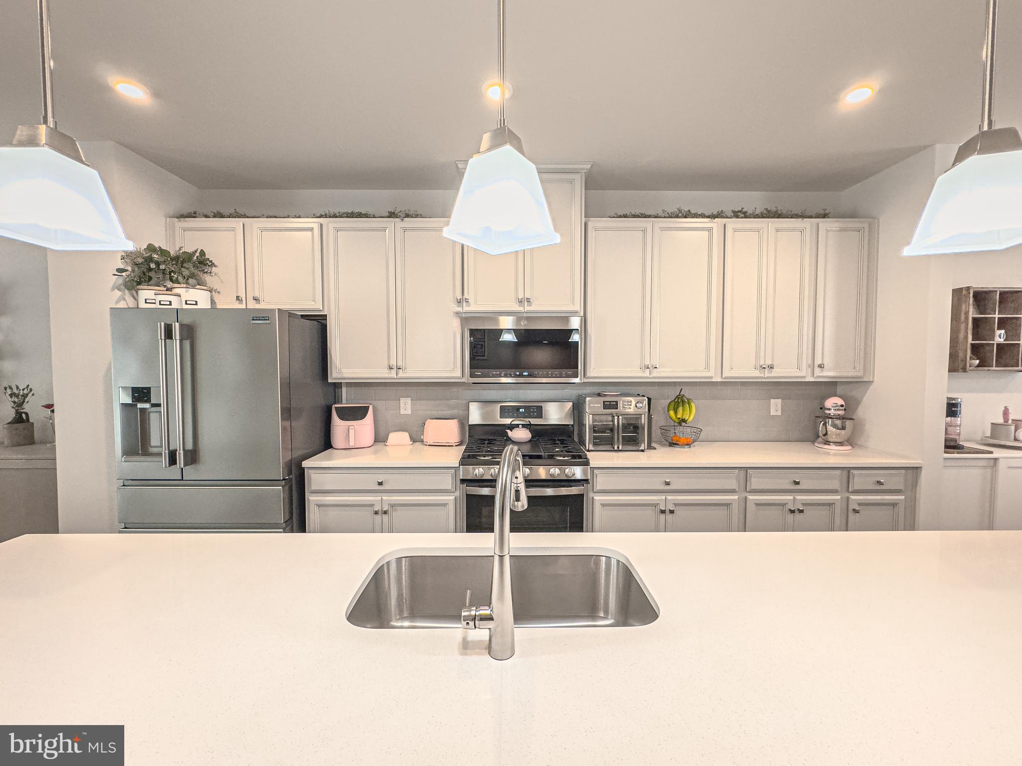 4 Flamingo Court Sewell, NJ 08080 - Photo 23 of 55 a kitchen with stainless steel appliances a refrigerator sink and cabinets