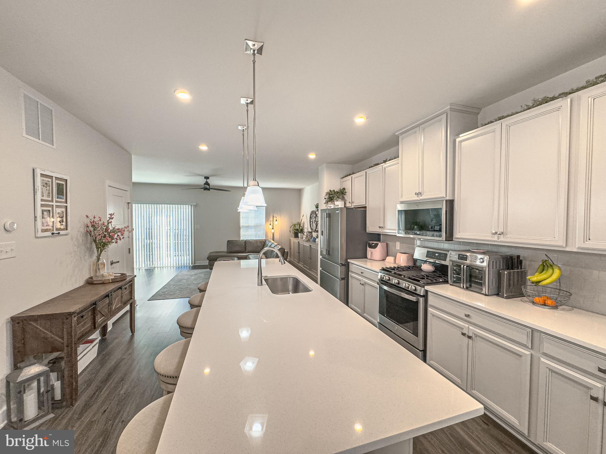 4 Flamingo Court Sewell, NJ 08080 - Photo 25 of 55 a large kitchen with kitchen island a large counter top appliances and cabinets