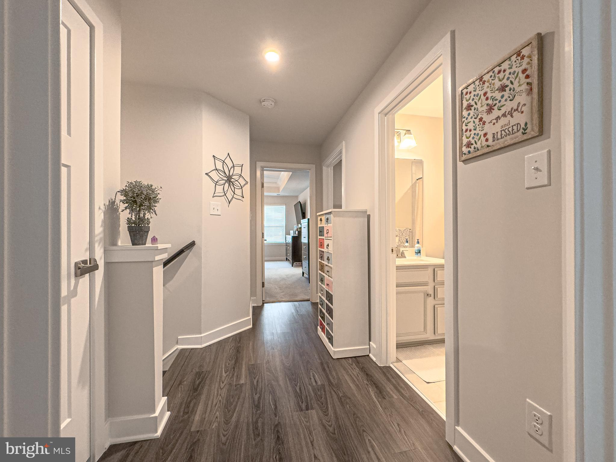 4 Flamingo Court Sewell, NJ 08080 - Photo 36 of 55 a view of a hallway with wooden floor and cabinets