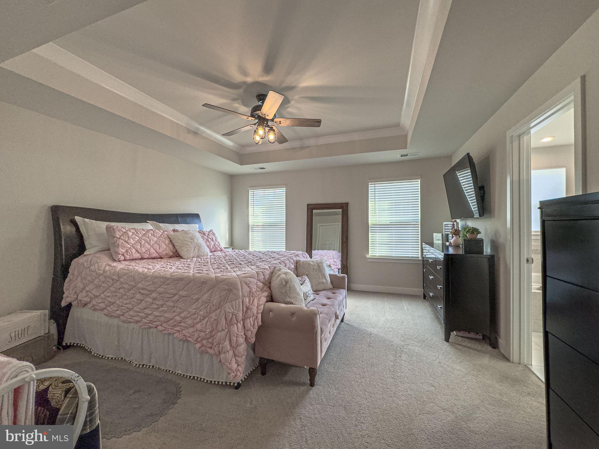 4 Flamingo Court Sewell, NJ 08080 - Photo 48 of 55 a spacious bedroom with a bed and a chandelier
