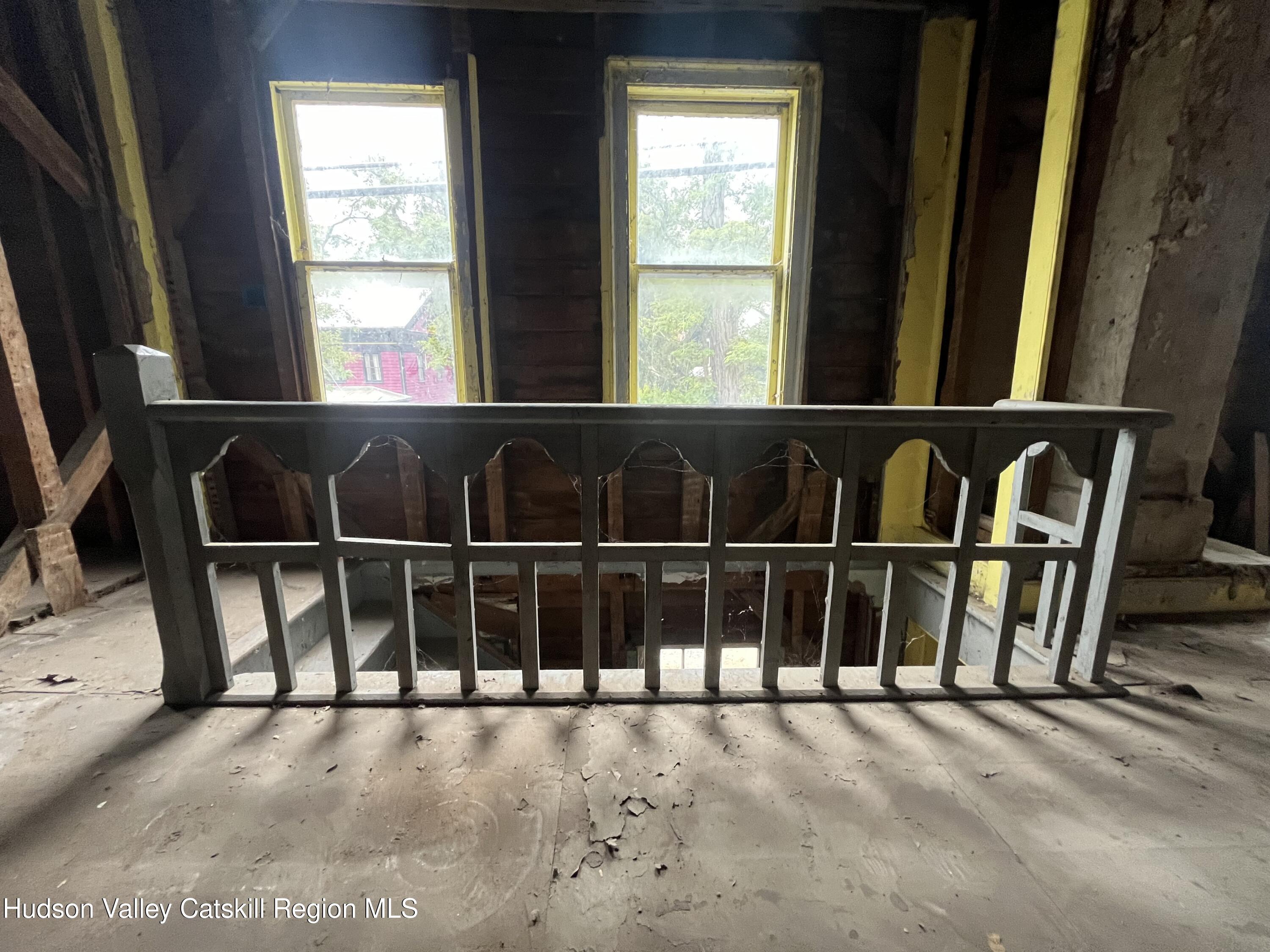 7838 Route 81 Oak Hill Oak Hill, NY 12460 - Photo 14 of 14 a view of an empty room with wooden floor and a window