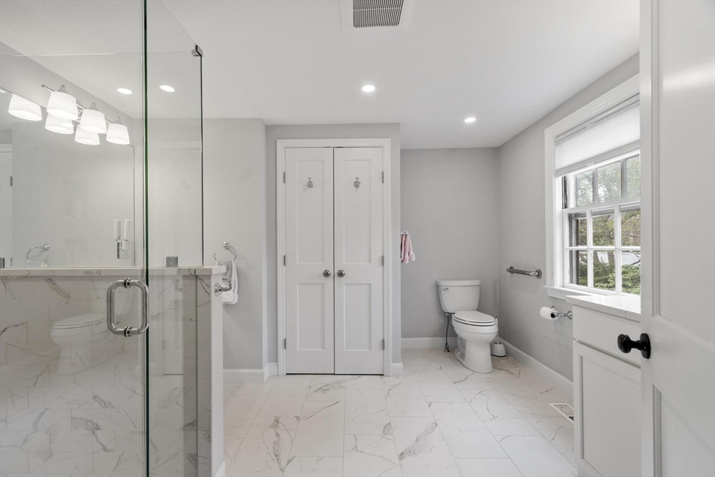 122 Southfield Road Concord, MA 01742 - Photo 12 of 28 a bathroom with a shower and a toilet