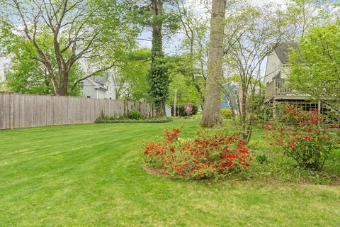 a view of a table and chairs in the garden