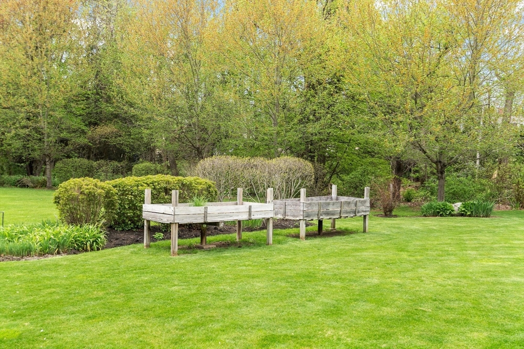 122 Southfield Road Concord, MA 01742 - Photo 25 of 28 a view of a table and chairs in the garden