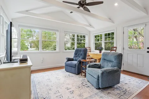 a living room with furniture and a window