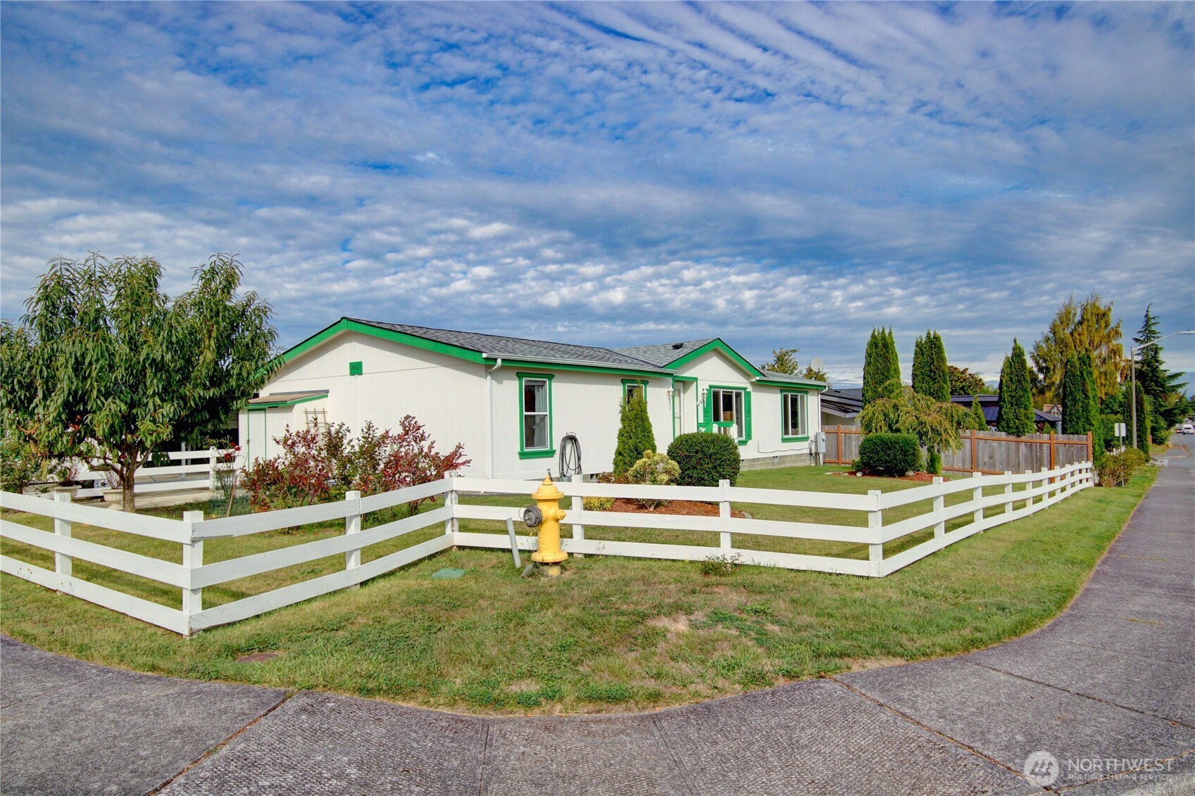 2901 Schuller Place Mount Vernon, WA 98273 - Photo 1 of 40 a front view of a house with a yard table and chairs