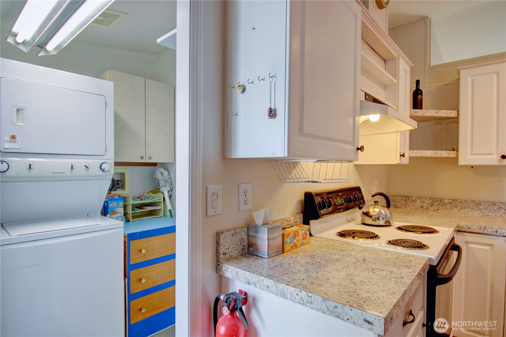 2901 Schuller Place Mount Vernon, WA 98273 - Photo 13 of 40 a room that has a sink and a stove in it
