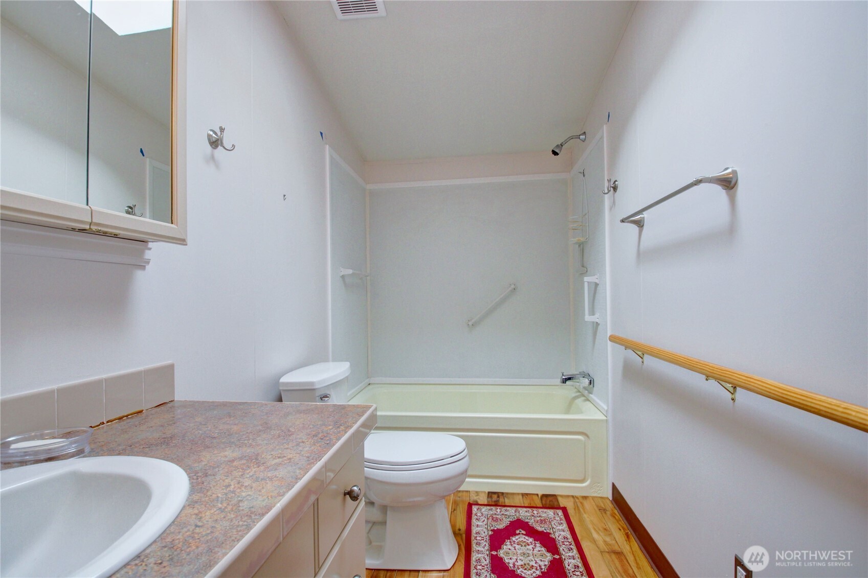 2901 Schuller Place Mount Vernon, WA 98273 - Photo 19 of 40 a bathroom with a granite countertop toilet a sink and a bathtub