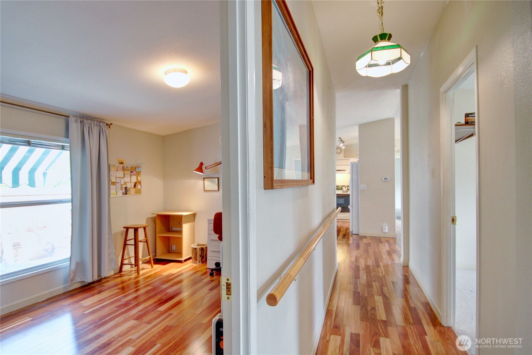 2901 Schuller Place Mount Vernon, WA 98273 - Photo 20 of 40 a view of a hallway with wooden floor and dining room