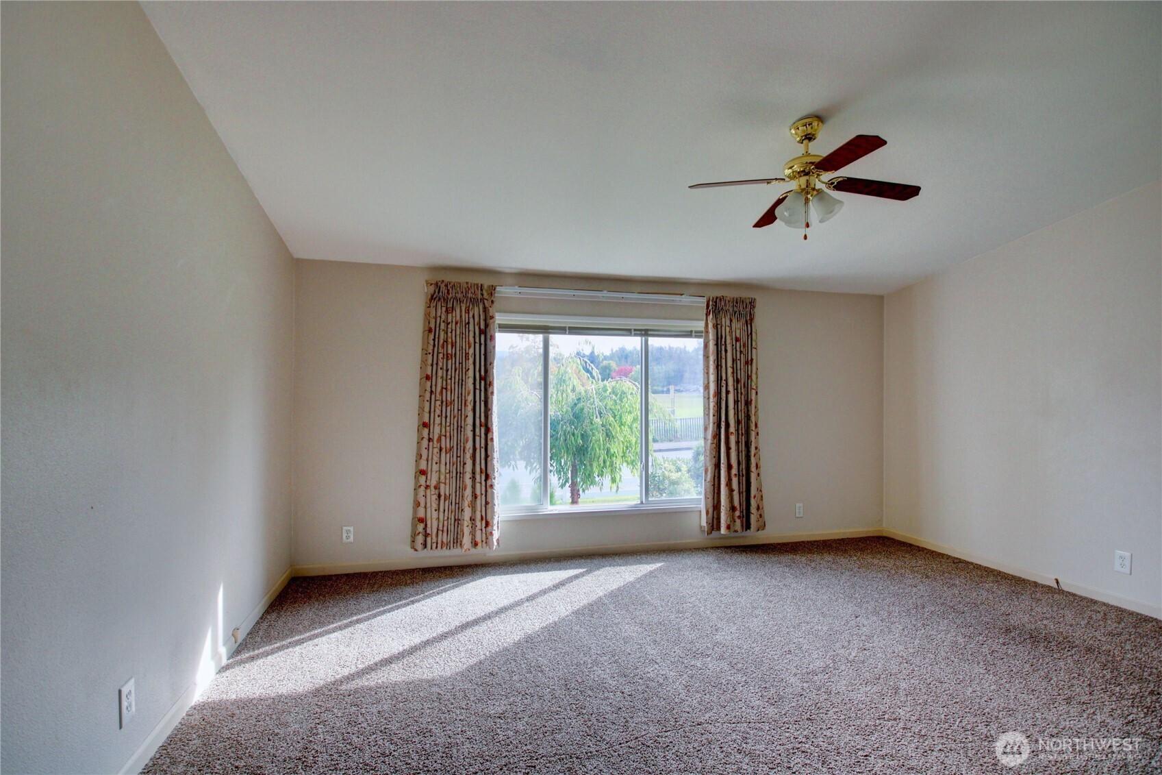 2901 Schuller Place Mount Vernon, WA 98273 - Photo 23 of 40 a view of room with a ceiling fan and window
