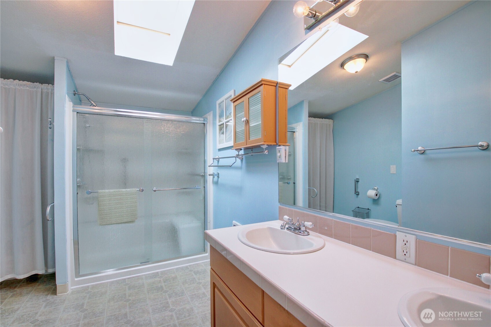 2901 Schuller Place Mount Vernon, WA 98273 - Photo 26 of 40 a bathroom with a sink and a mirror