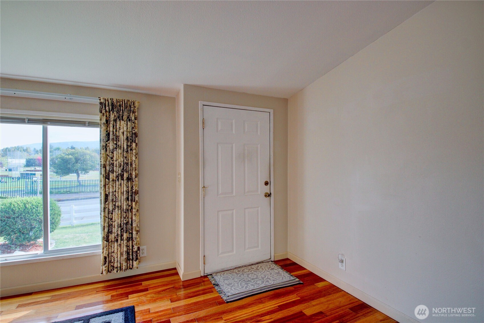 2901 Schuller Place Mount Vernon, WA 98273 - Photo 3 of 40 a view of an empty room with window and wooden floor