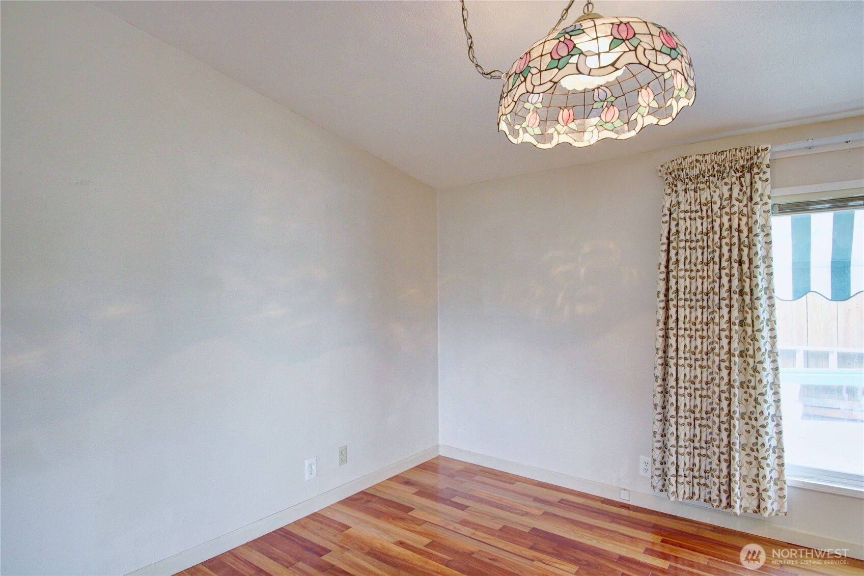 2901 Schuller Place Mount Vernon, WA 98273 - Photo 9 of 40 an empty room with wooden floor and windows