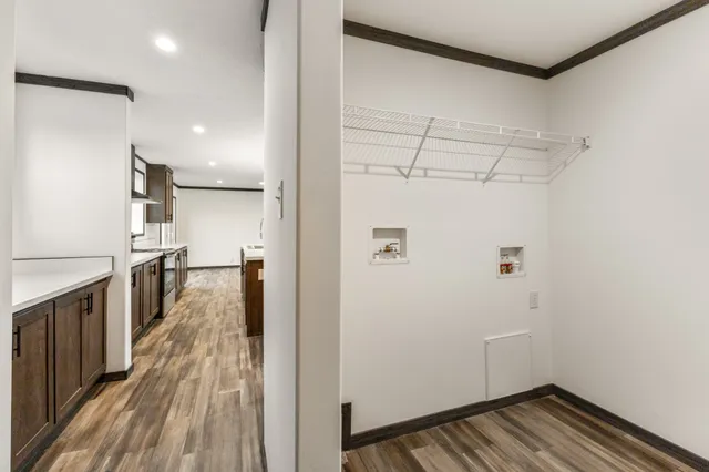 a view of a kitchen with wooden floor
