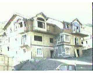 135 Knudson Ranch, Unit 15 Edwards, CO 81632 - Photo 1 of 1 a front view of a residential apartment building with a yard