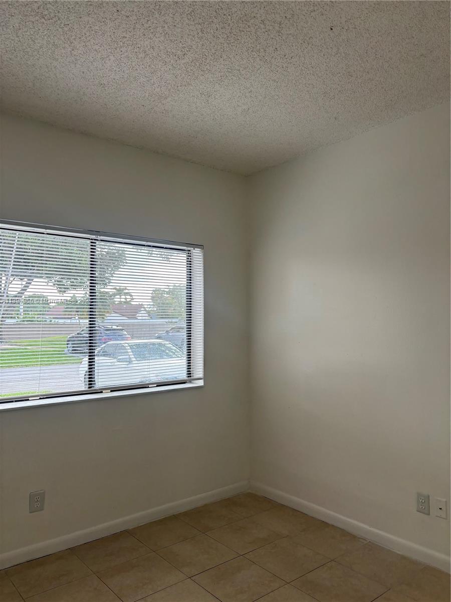 3629 Inverrary Boulevard West Lauderhill, FL 33319 - Photo 11 of 16 an empty room with a window