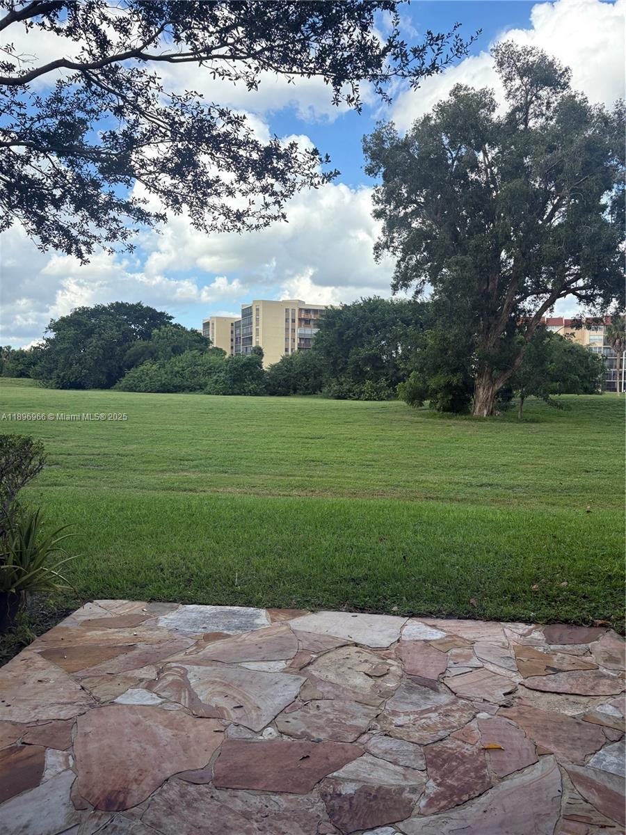 3629 Inverrary Boulevard West Lauderhill, FL 33319 - Photo 3 of 16 a view of a grassy field with an trees