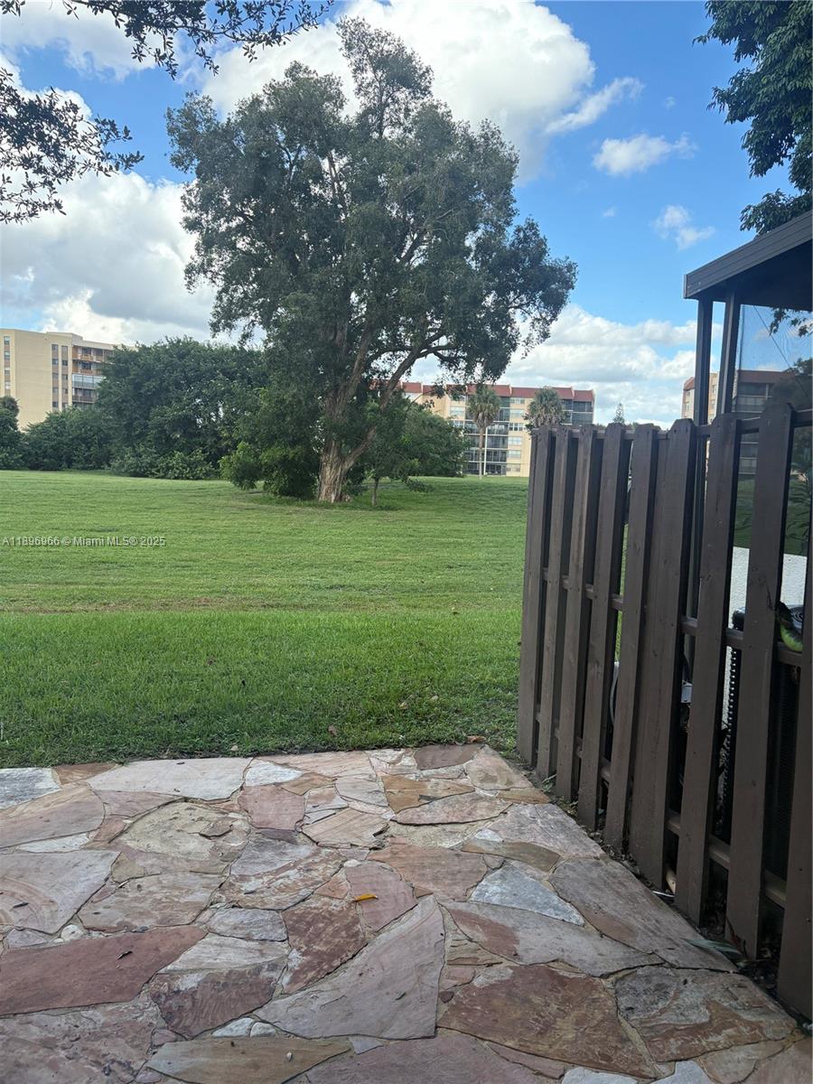 3629 Inverrary Boulevard West Lauderhill, FL 33319 - Photo 5 of 16 a view of a backyard with wooden fence