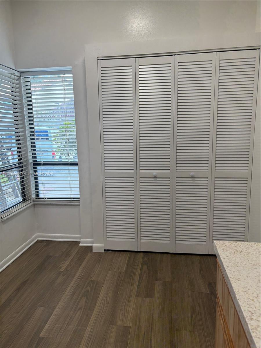 3629 Inverrary Boulevard West Lauderhill, FL 33319 - Photo 6 of 16 an empty room with wooden floor and windows