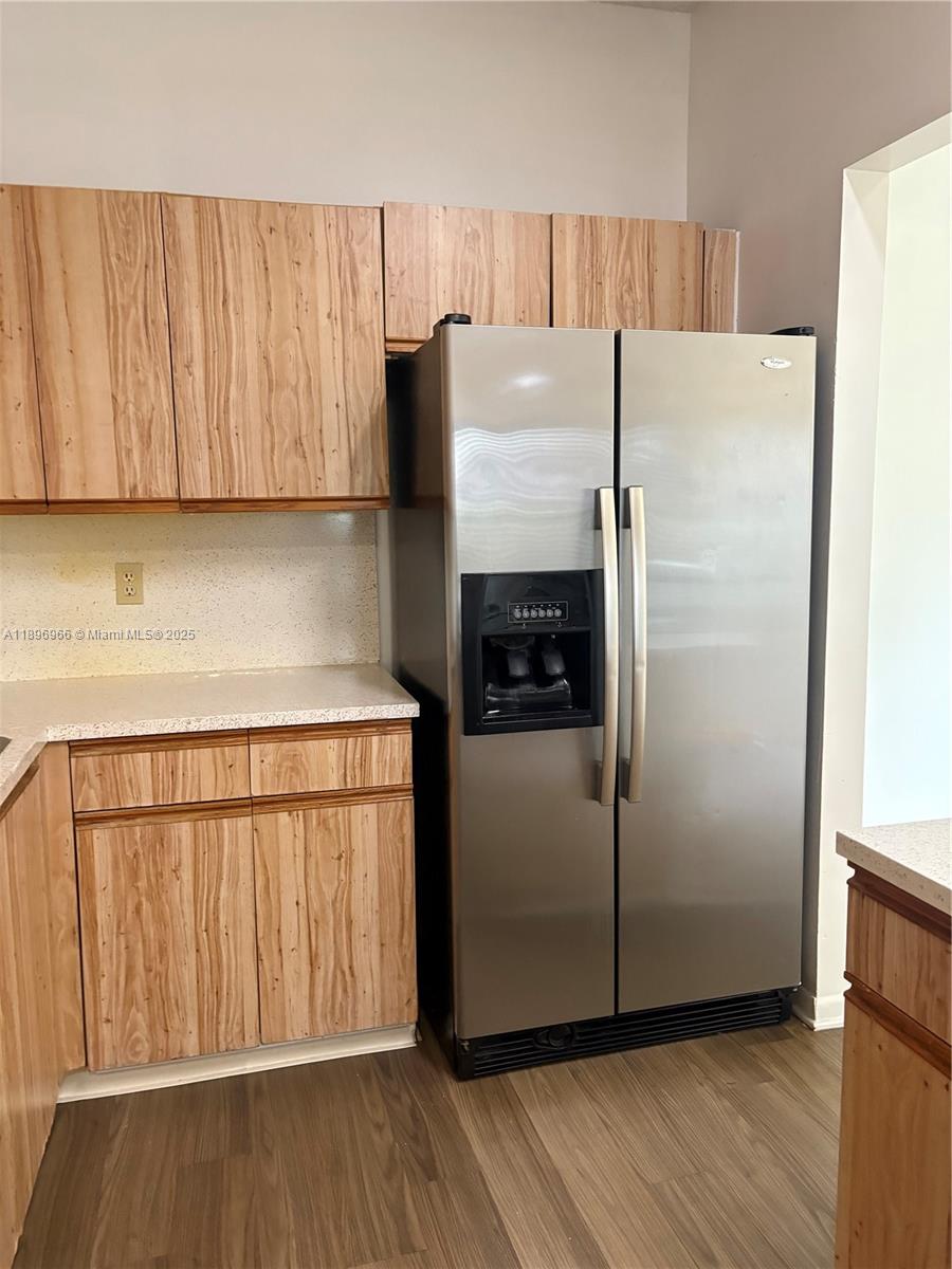 3629 Inverrary Boulevard West Lauderhill, FL 33319 - Photo 7 of 16 a kitchen with a refrigerator sink and cabinets