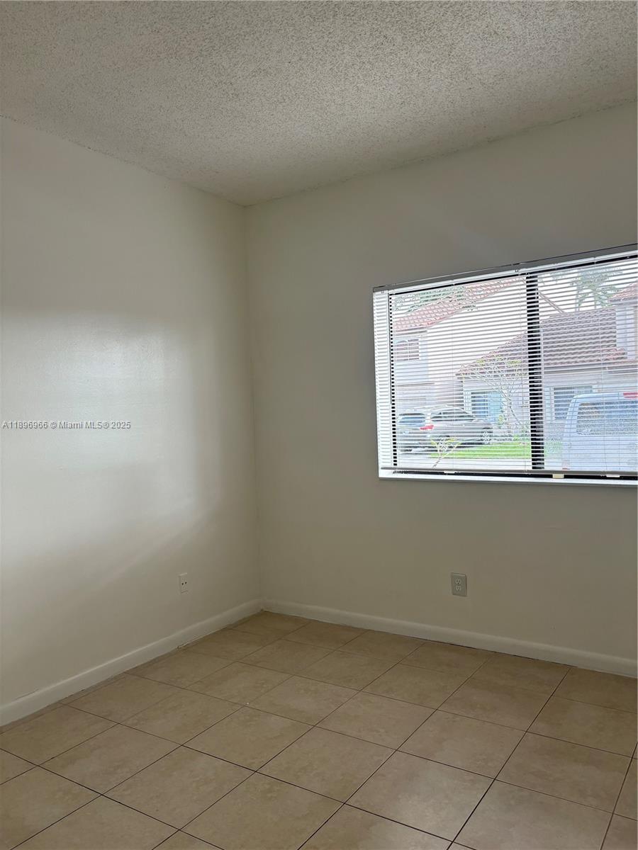 3629 Inverrary Boulevard West Lauderhill, FL 33319 - Photo 9 of 16 an empty room with windows