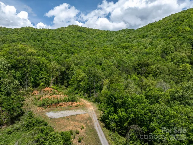 a view of a street with a building in the background