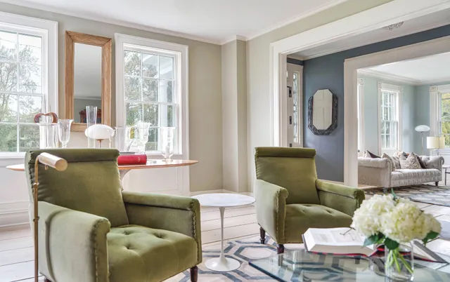 a living room with furniture and windows