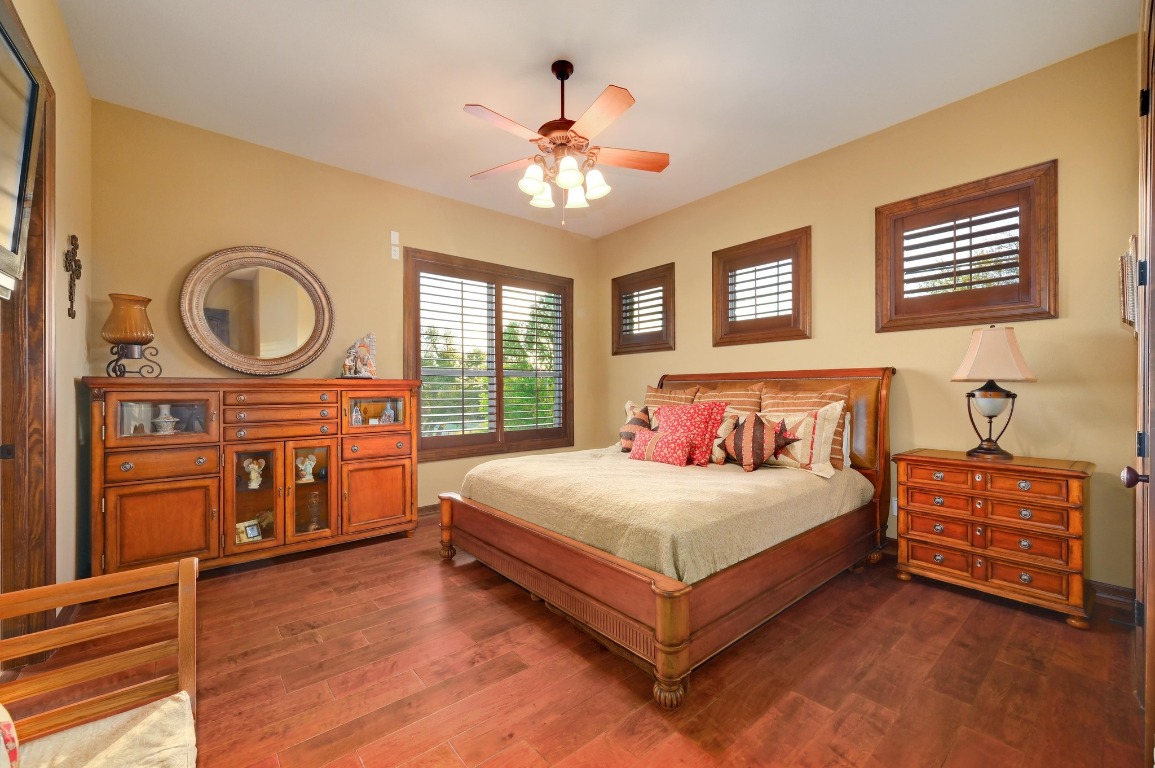 1298 Mystic Parkway Spring Branch, TX 78070 - Photo 23 of 40 a bedroom with a large bed and a chandelier