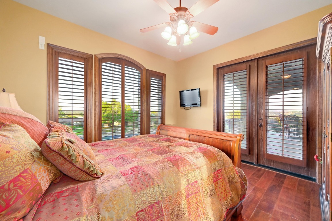 1298 Mystic Parkway Spring Branch, TX 78070 - Photo 27 of 40 a bedroom with a large bed and a large window