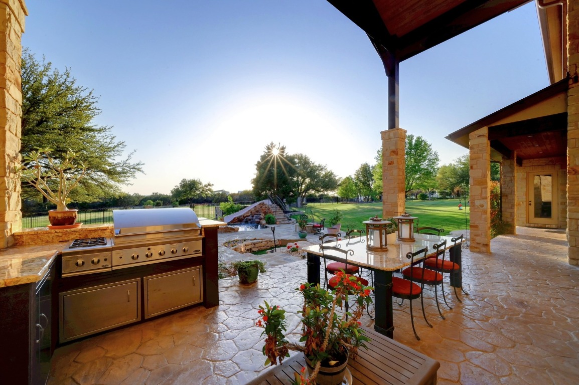 1298 Mystic Parkway Spring Branch, TX 78070 - Photo 32 of 40 a view of a patio with a table chairs and a fire pit