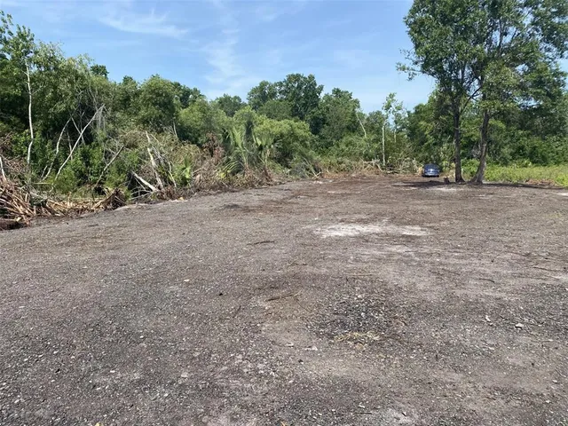 a view of outdoor space with trees all around