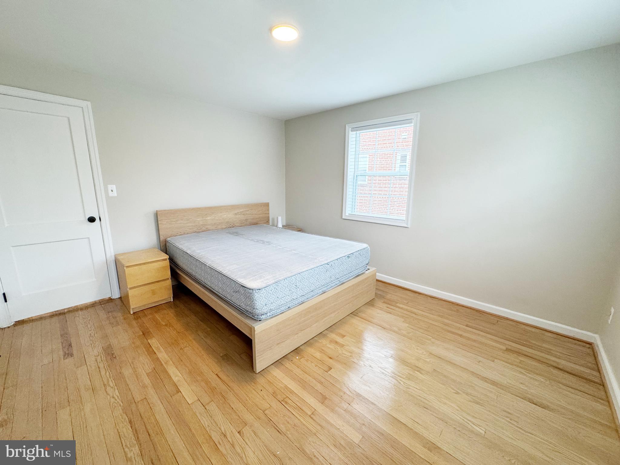 11969 Andrew Street Silver Spring, MD 20902 - Photo 11 of 20 a view of a room with wooden floor and window