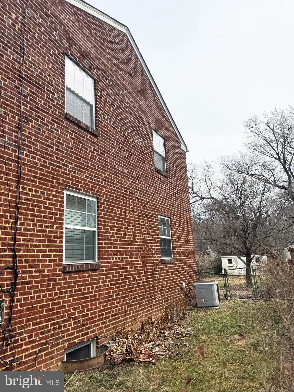 11969 Andrew Street Silver Spring, MD 20902 - Photo 17 of 20 a brick building with a bench in front of it