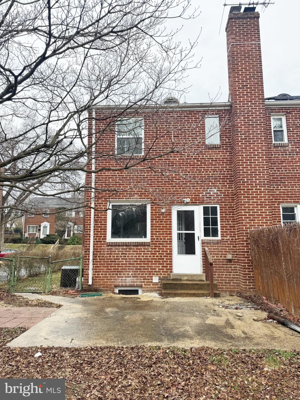 11969 Andrew Street Silver Spring, MD 20902 - Photo 18 of 20 a front view of a house with a yard and garage