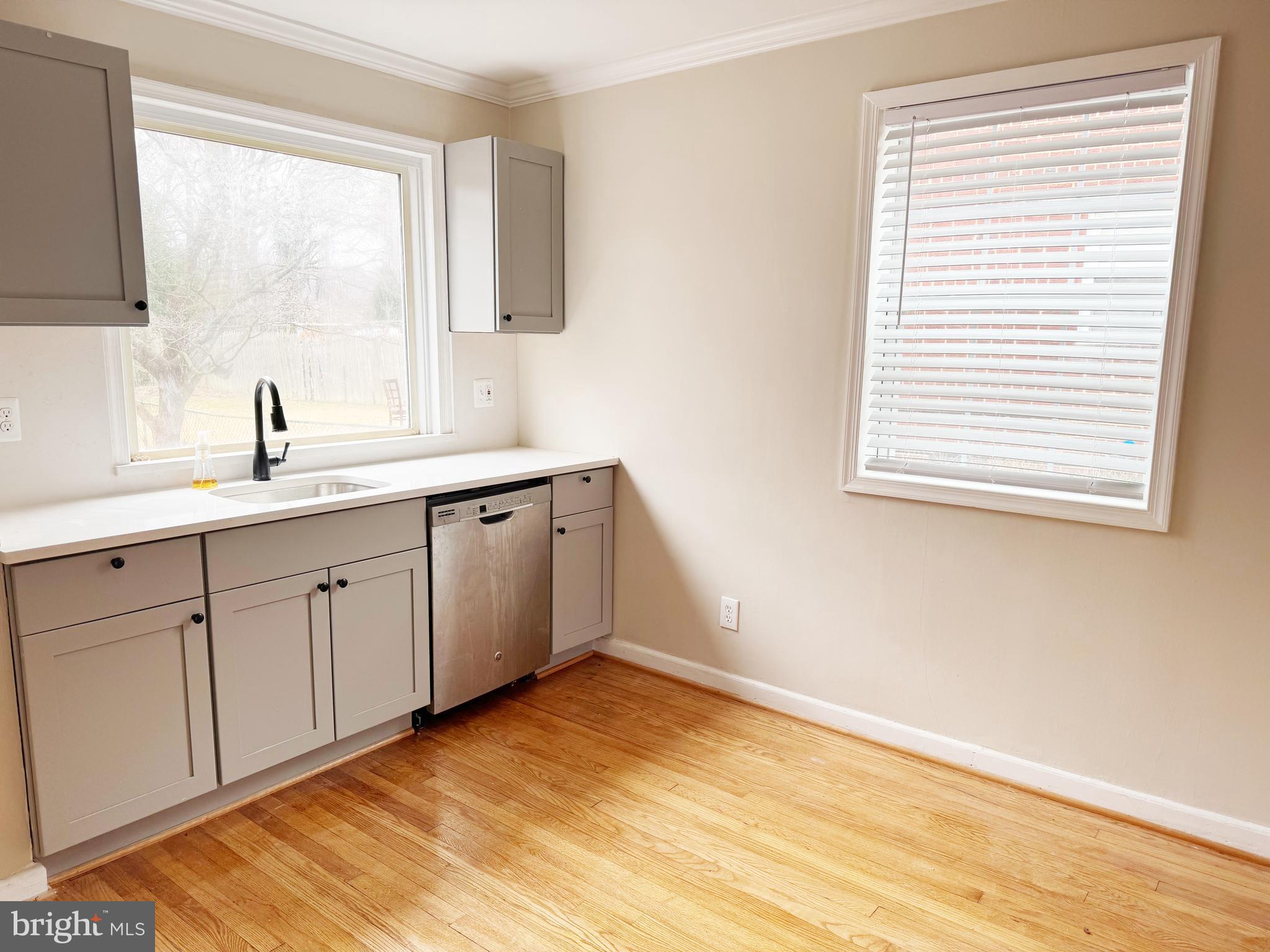 11969 Andrew Street Silver Spring, MD 20902 - Photo 5 of 20 a kitchen with a sink cabinets appliances and a window