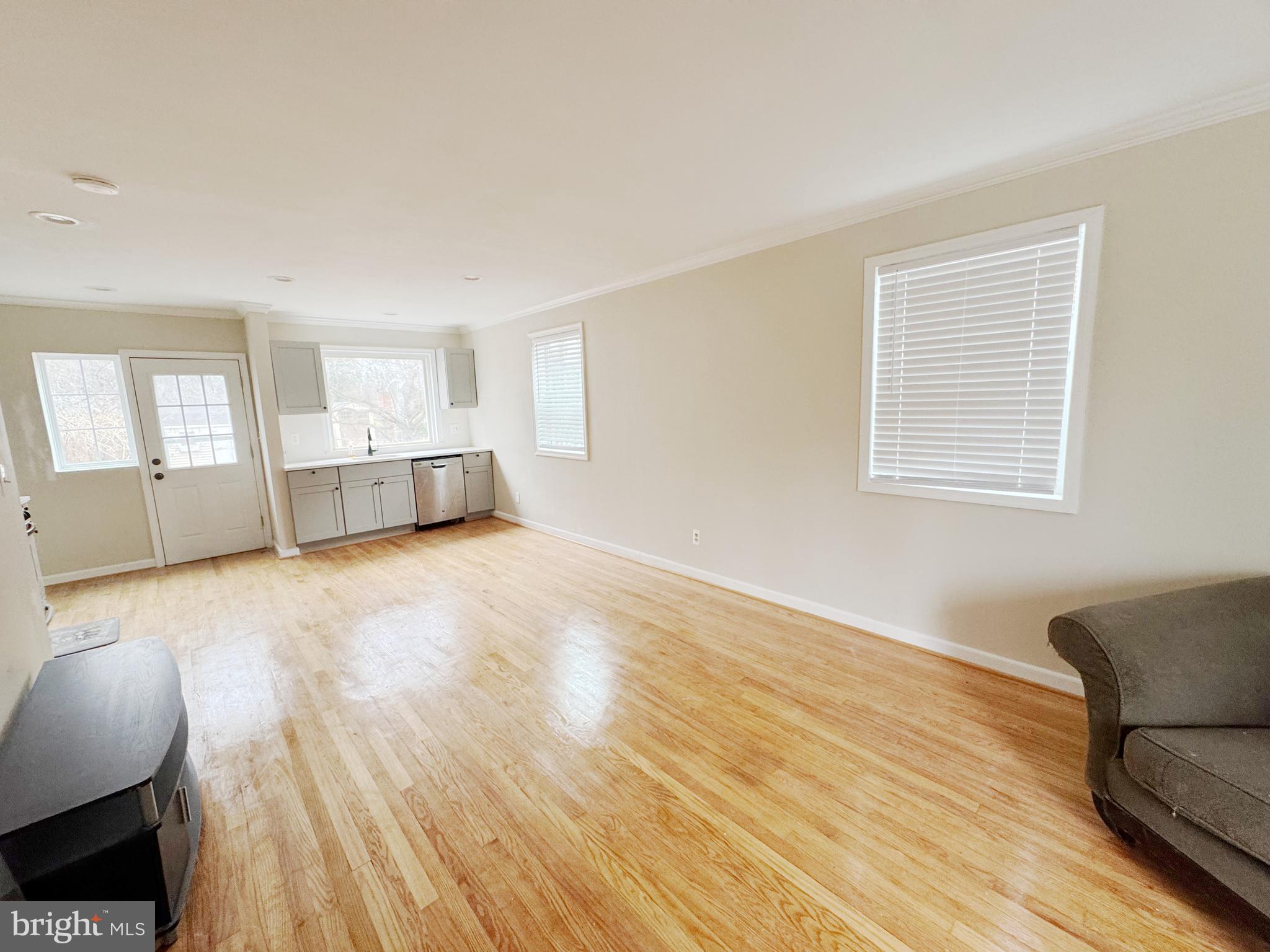 11969 Andrew Street Silver Spring, MD 20902 - Photo 8 of 20 a view of livingroom with furniture and wooden floor