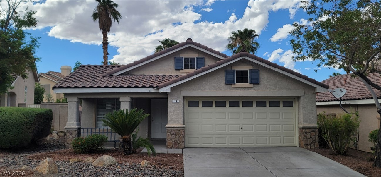 19 Rue De Parc Henderson, NV 89074 - Photo 1 of 23 Spanish tile roofing and stone accents define this inviting single-story home facade.