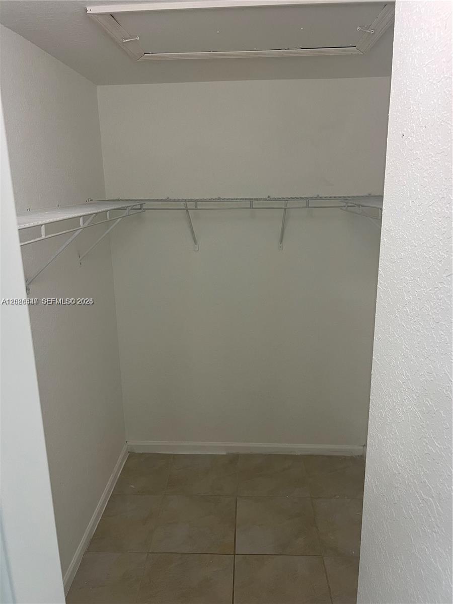 2910 Southeast 15th Road, Unit 55 Homestead, FL 33035 - Photo 10 of 13 a view of a room with racks on the wall
