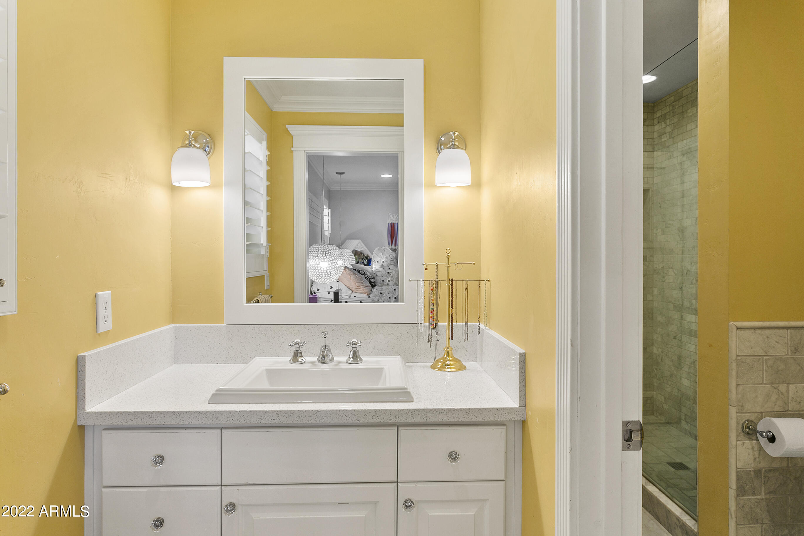 101 East Lawrence Road Phoenix, AZ 85012 - Photo 22 of 48 a bathroom with a sink and a mirror