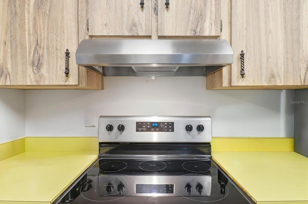 3103 South Bay Berry Point Inverness, FL 34450 - Photo 21 of 50 a kitchen with a stove and a microwave